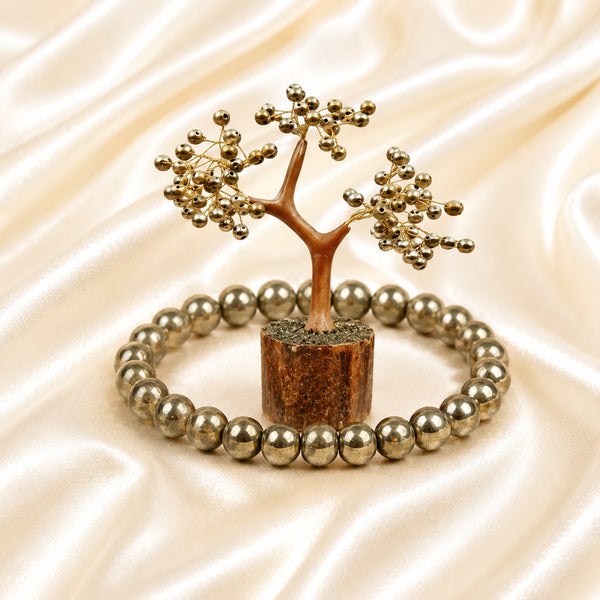 Golden Pyrite Bracelet & Tree Set displayed fully on white silk cloth to show its natural colour, shape and finish