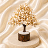Gomati Chakra Crystal Tree displayed fully on white silk cloth to show its natural colour, shape and finish