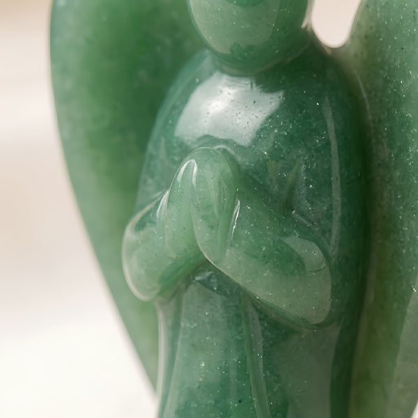 Close-up of authentic natural Green Aventurine showing crystal texture, colour and craftsmanship – green aventurine angel symbol of luck healing and prosperity
