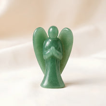 Load image into Gallery viewer, Green Aventurine Angel Figurine displayed fully on white silk cloth to show its natural colour, shape and finish
