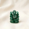Green Aventurine Ganesh Idol displayed fully on white silk cloth to show its natural colour, shape and finish