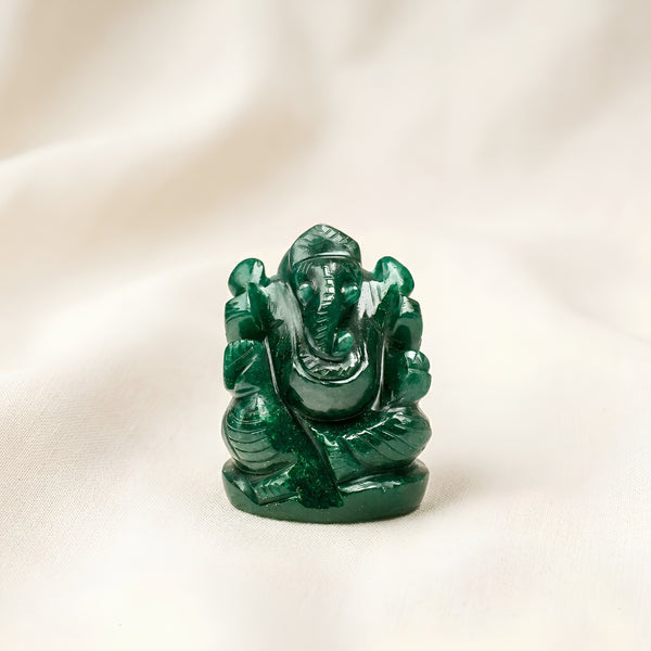 Green Aventurine Ganesh Idol displayed fully on white silk cloth to show its natural colour, shape and finish