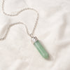 Green Aventurine Pencil Pendant displayed fully on white silk cloth to show its natural colour, shape and finish