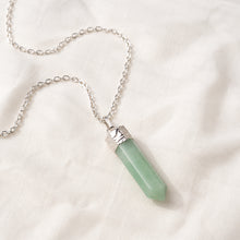 Load image into Gallery viewer, Green Aventurine Pencil Pendant displayed fully on white silk cloth to show its natural colour, shape and finish
