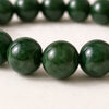 Close-up of authentic natural Green Jade showing crystal texture, colour and craftsmanship