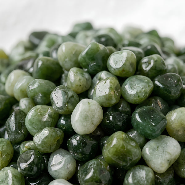 Close-up of authentic natural Green Jade showing crystal texture, colour and craftsmanship – green jade chips stone symbol of prosperity longevity and serenity