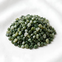 Load image into Gallery viewer, Green Jade Chips displayed fully on white silk cloth to show its natural colour, shape and finish
