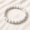 Howlite Bracelet displayed fully on white silk cloth to show its natural colour, shape and finish
