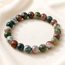 Load image into Gallery viewer, Indian Agate Bracelet displayed fully on white silk cloth to show its natural colour, shape and finish
