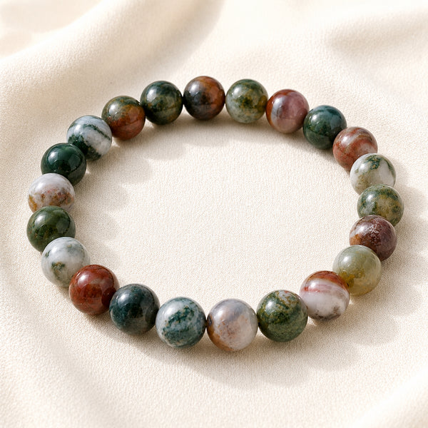 Indian Agate Bracelet displayed fully on white silk cloth to show its natural colour, shape and finish