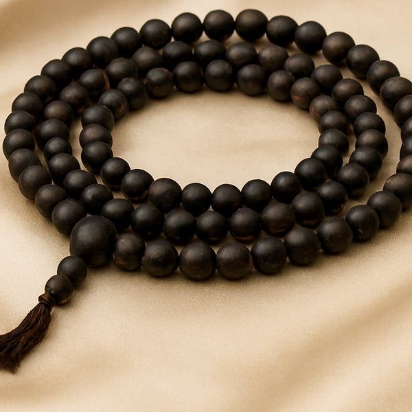 Close-up of authentic natural Karungali showing crystal texture, colour and craftsmanship