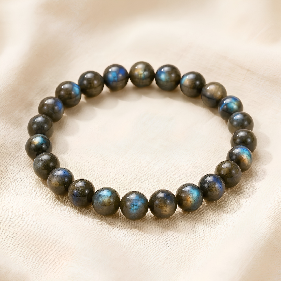 Labradorite Chips displayed fully on white silk cloth to show its natural colour, shape and finish