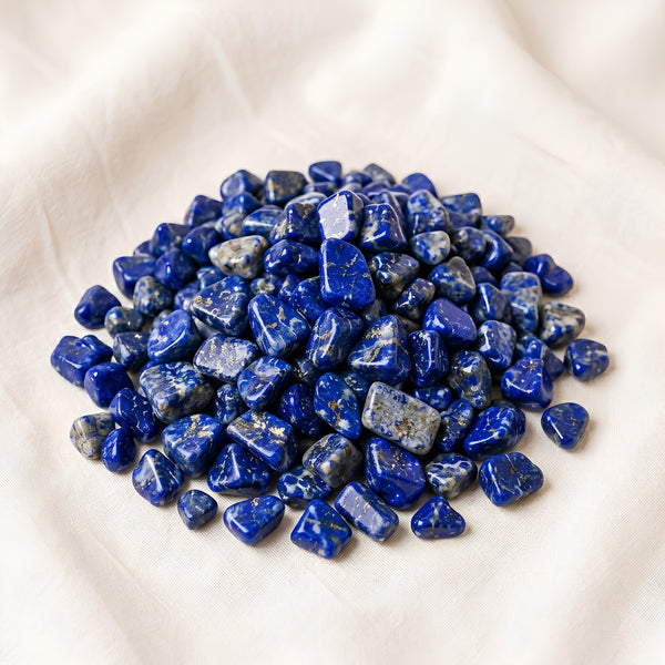 Lapis Lazuli Chips displayed fully on white silk cloth to show its natural colour, shape and finish