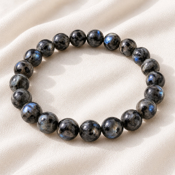 Larvikite Bracelet displayed fully on white silk cloth to show its natural colour, shape and finish
