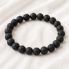 Lava Extract Bracelet displayed fully on white silk cloth to show its natural colour, shape and finish