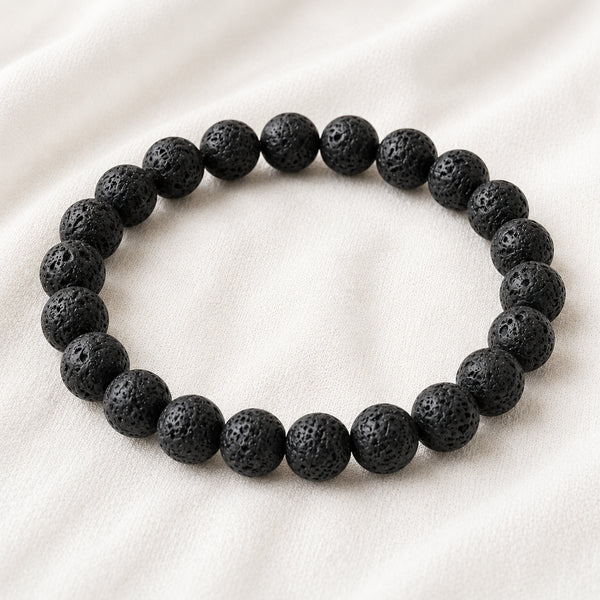 Lava Extract Bracelet displayed fully on white silk cloth to show its natural colour, shape and finish