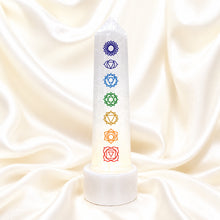 Load image into Gallery viewer, Selenite with 7 Chakra Lamp displayed fully on white silk cloth to show its natural colour, shape and finish
