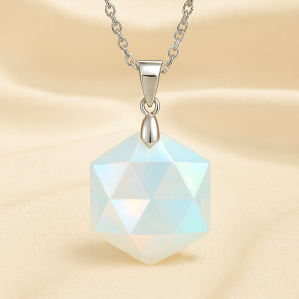 Opal Hexagon Pendant displayed fully on white silk cloth to show its natural colour, shape and finish
