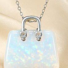 Load image into Gallery viewer, Close-up of authentic natural Opal showing crystal texture, colour and craftsmanship – opal mini handbag pendant symbol of spark hope and luxury
