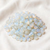 Opalite Chips displayed fully on white silk cloth to show its natural colour, shape and finish