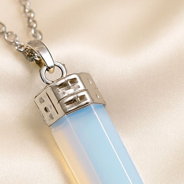 Close-up of authentic natural Opalite showing crystal texture, colour and craftsmanship – opalite pencil pendant chain healing crystal for clarity healing and