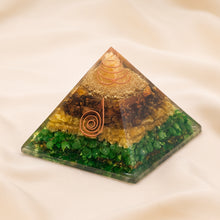 Load image into Gallery viewer, Money Magnet Orgone Pyramid displayed fully on white silk cloth to show its natural colour, shape and finish
