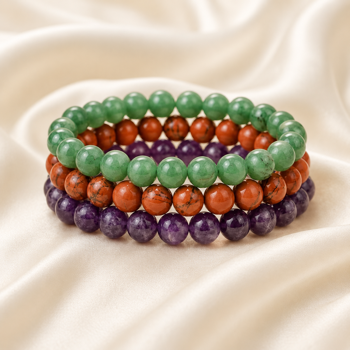 Wealth & Prosperity Bracelet Combo displayed fully on white silk cloth to show its natural colour, shape and finish