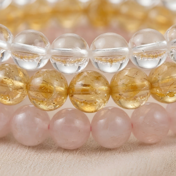 Close-up of authentic natural Clear Quartz, Rose Quartz and Citrine showing crystal texture, colour and craftsmanship