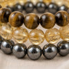 Close-up of authentic natural Tiger Eye, Hematite and Citrine showing crystal texture, colour and craftsmanship