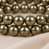 Close-up of authentic natural Pyrite showing crystal texture, colour and craftsmanship – pack of 2 pyrite bracelets wealth protection positivity energy evashu