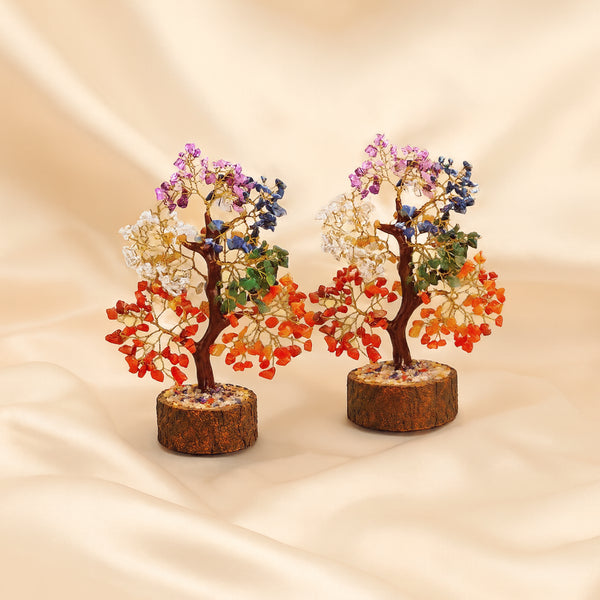 Seven Chakra Crystal Tree Pack displayed fully on white silk cloth to show its natural colour, shape and finish – pack of 2 seven chakra crystal trees wooden
