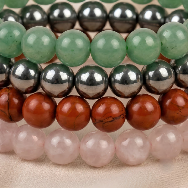 Close-up of authentic natural Green Aventurine, Rose Quartz and Red Jasper showing crystal texture, colour and craftsmanship