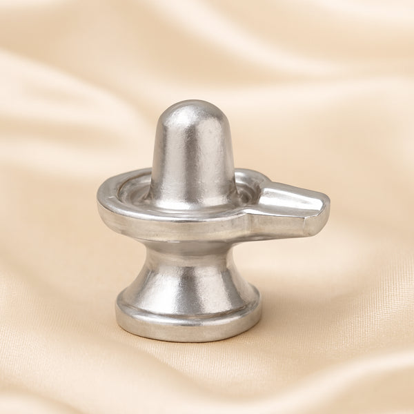 Parad Shivling Idol displayed fully on white silk cloth to show its natural colour, shape and finish