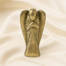 Load image into Gallery viewer, Pyrite Angel Figurine displayed fully on white silk cloth to show its natural colour, shape and finish
