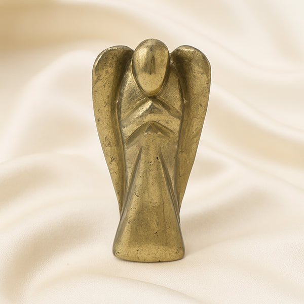 Pyrite Angel Figurine displayed fully on white silk cloth to show its natural colour, shape and finish