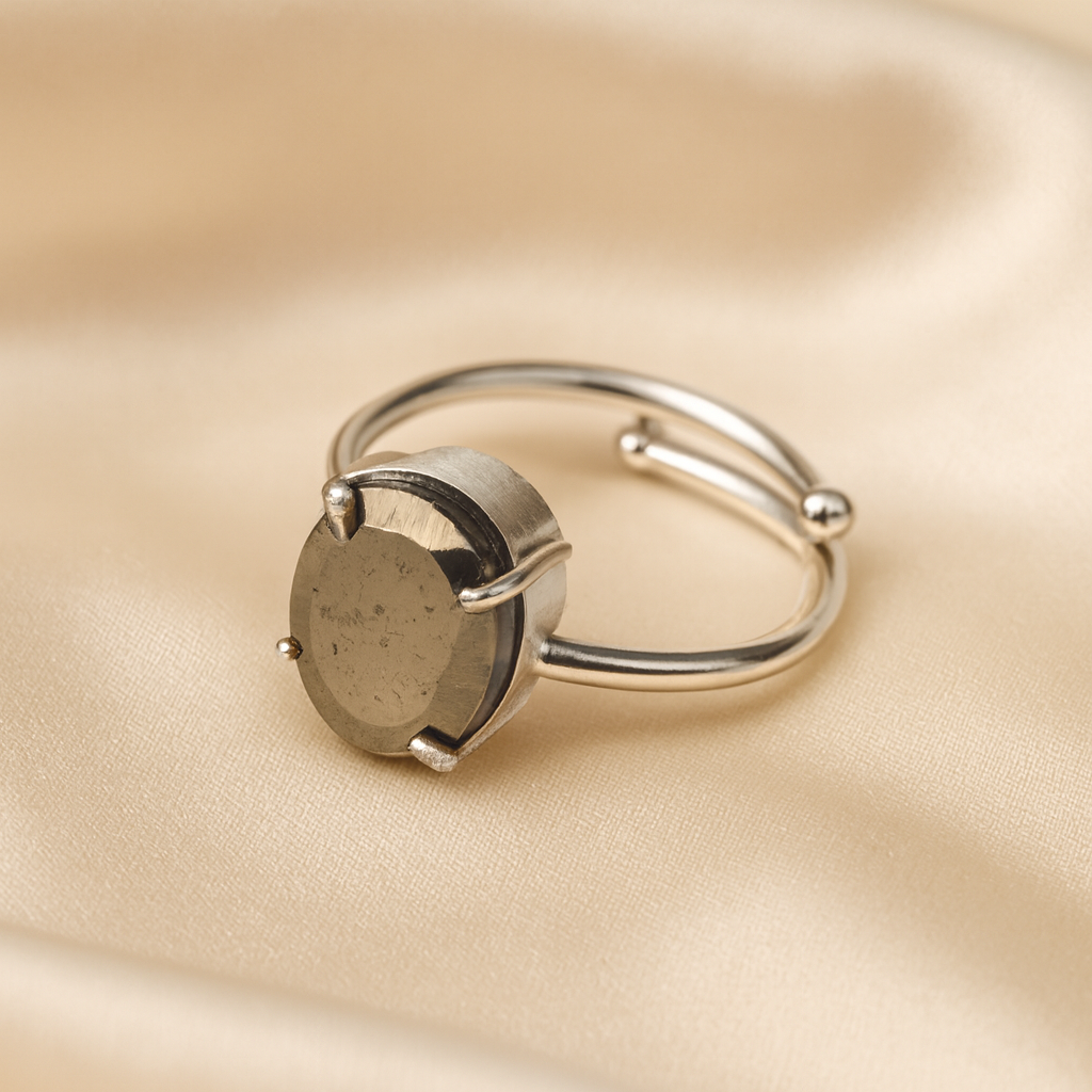 Pyrite Adjustable Ring displayed fully on white silk cloth to show its natural colour, shape and finish – pyrite ring adjustable symbol of abundance confidence
