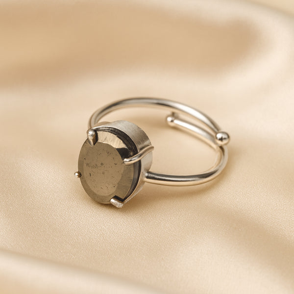 Pyrite Adjustable Ring displayed fully on white silk cloth to show its natural colour, shape and finish – pyrite ring adjustable symbol of abundance confidence