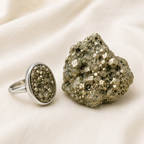 Pyrite Ring displayed fully on white silk cloth to show its natural colour, shape and finish