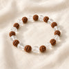 Clear Quartz & Rudraksha displayed fully on white silk cloth to show its natural colour, shape and finish