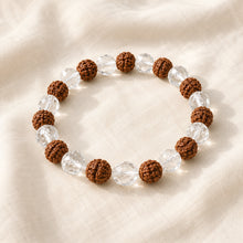 Load image into Gallery viewer, Clear Quartz &amp; Rudraksha displayed fully on white silk cloth to show its natural colour, shape and finish
