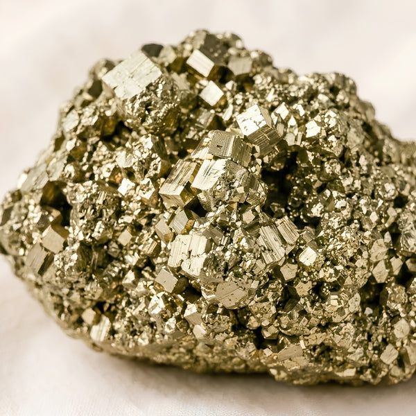 Close-up of authentic natural Raw Pyrite showing crystal texture, colour and craftsmanship – raw pyrite stone natural crystal prosperity confidence protection