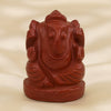 Red Jasper Ganesh Idol displayed fully on white silk cloth to show its natural colour, shape and finish