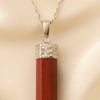 Close-up of authentic natural Red Jasper showing crystal texture, colour and craftsmanship – red jasper pencil pendant symbol of strength stability and