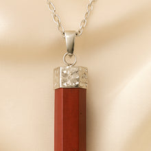 Load image into Gallery viewer, Close-up of authentic natural Red Jasper showing crystal texture, colour and craftsmanship – red jasper pencil pendant symbol of strength stability and
