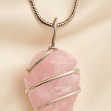 Load image into Gallery viewer, Close-up of authentic natural Rose Quartz showing crystal texture, colour and craftsmanship – rose quartz arrowhead pendant symbol of love compassion and
