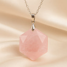 Load image into Gallery viewer, Rose Quartz Hexagon Pendant displayed fully on white silk cloth to show its natural colour, shape and finish
