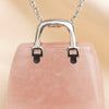 Close-up of authentic natural Rose Quartz showing crystal texture, colour and craftsmanship – rose quartz mini handbag pendant symbol of love gentleness and