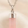 Close-up of authentic natural Rose Quartz showing crystal texture, colour and craftsmanship – rose quartz pencil pendant with chain helps in love compassion