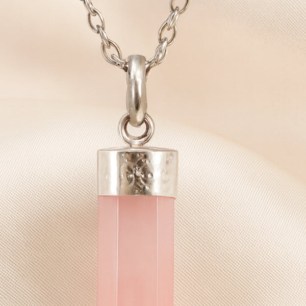 Close-up of authentic natural Rose Quartz showing crystal texture, colour and craftsmanship – rose quartz pencil pendant with chain helps in love compassion
