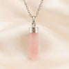 Rose Quartz Pencil Pendant displayed fully on white silk cloth to show its natural colour, shape and finish